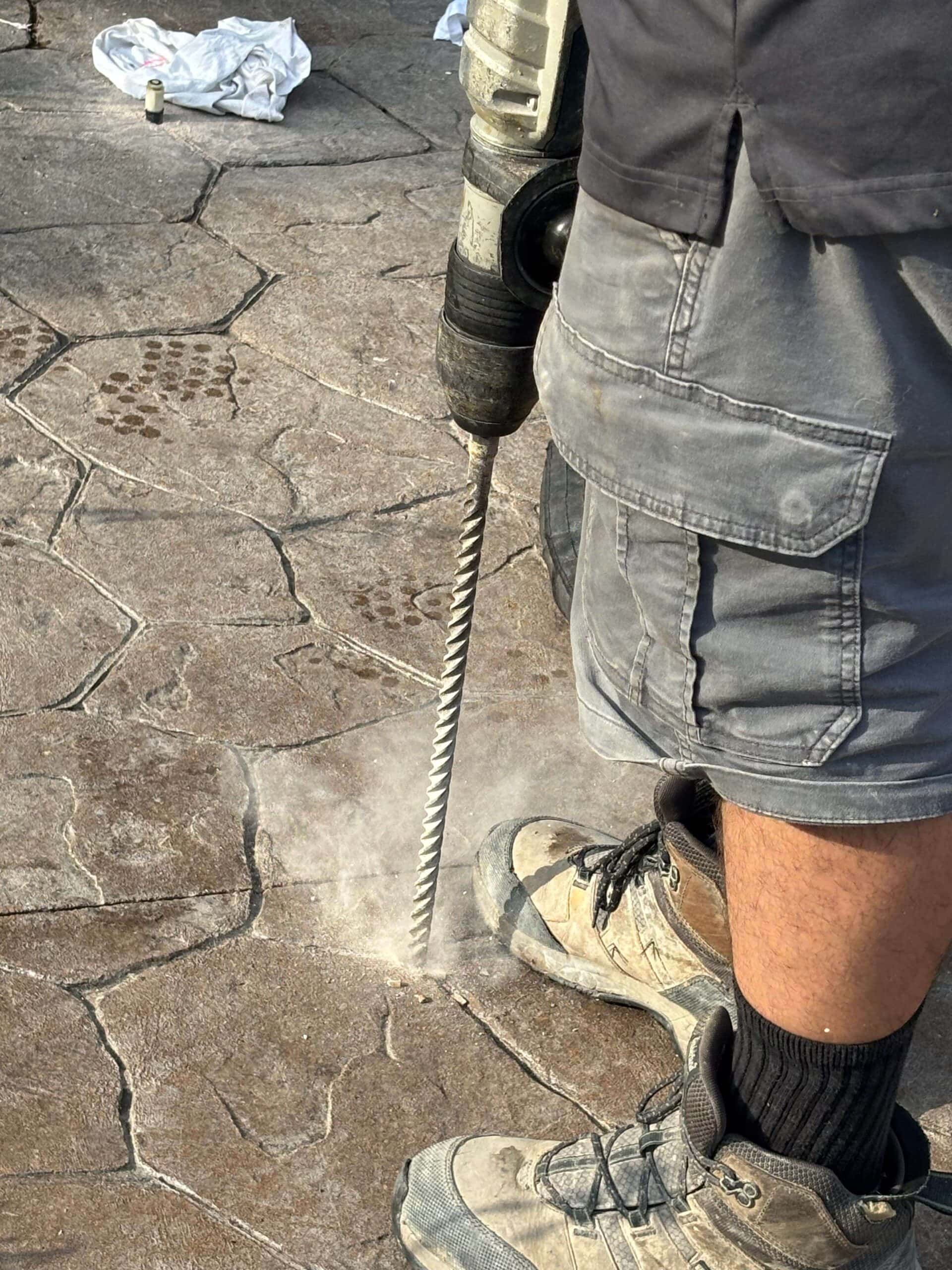 A concrete slab being drilled for a lifting foam application.