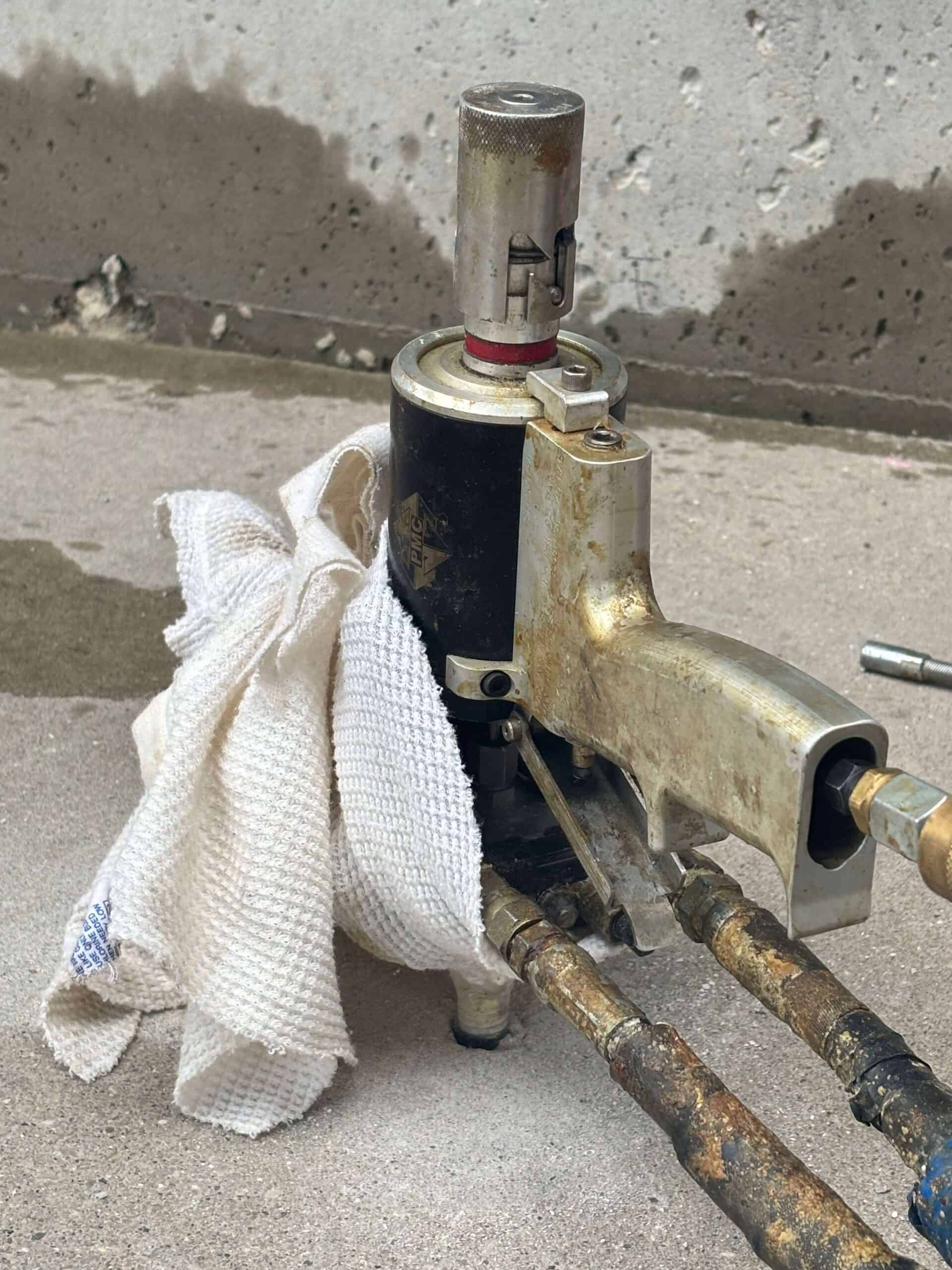 A concrete slab being injected with lifting foam.